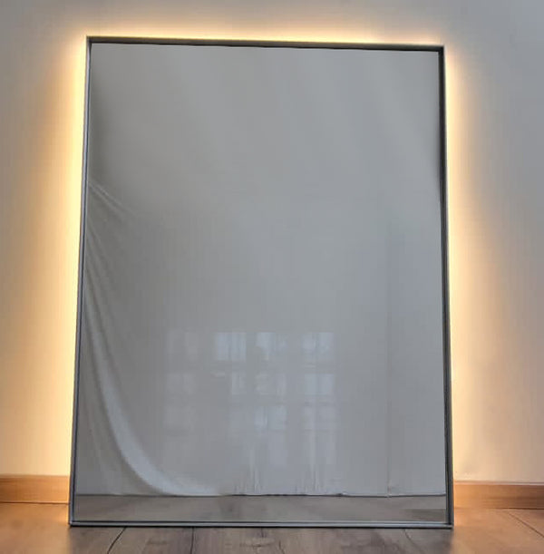 Rectangular mirror with metal trim shown with backlight 
metal wall decor with mirror
mirrors for home
decorative mirrors for home
mirrors for a wall
light mirrors for bathroom
mirrors for bedroom
fancy wall mirrors for living room